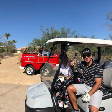 firefighter posing with liquor bottle