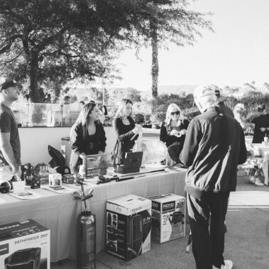 The raffle table with people in black and white