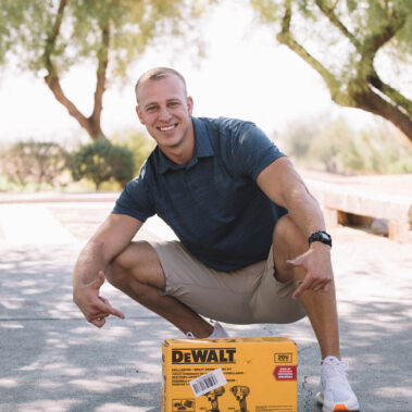 Guy posing the his raffle prize