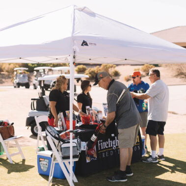 People visiting the Firefighters First Credit Union booth