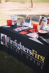 A close up of the Firefighters First Credit Union booth