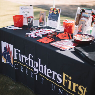 A close up of the Firefighters First Credit Union booth