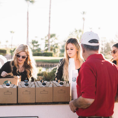 Ladies serving Starbucks boxes