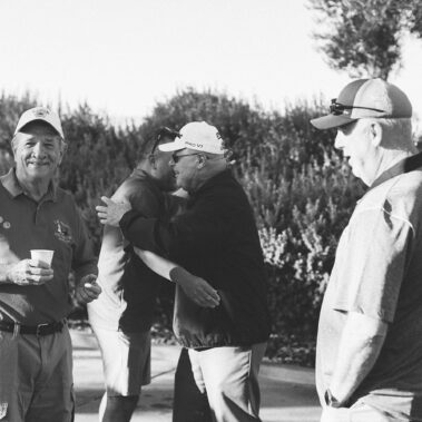 Guy enjoying golf in black in white