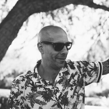 Guy smiling in black and white