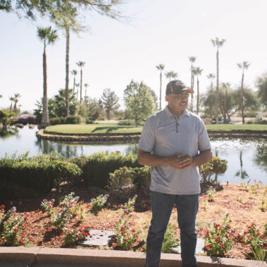 Guy standing smiling again