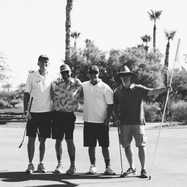 Guys posing for a picture in black and white