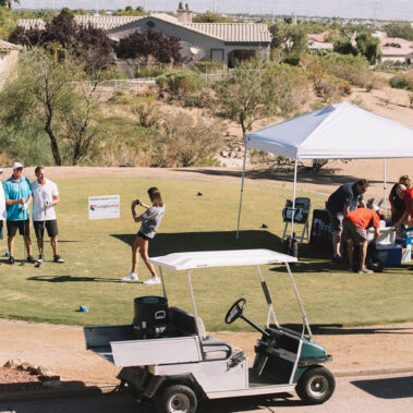 Taking picture of golfers finishing