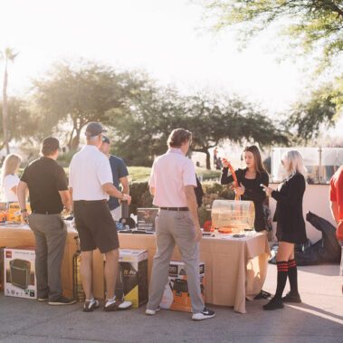 People buying ticket at the raffle table