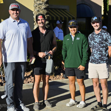 4 golfers posing for a photo before tee time.